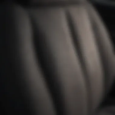 Close-up view of a high-quality cloth seat cover showcasing intricate fabric patterns.