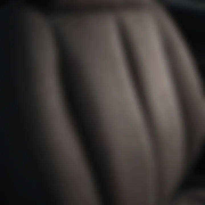 Close-up view of a high-quality cloth seat cover showcasing intricate fabric patterns.