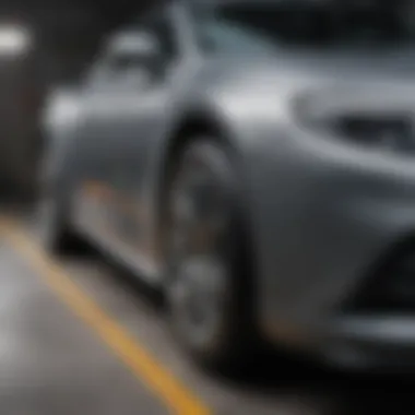 Applying touch-up paint to a scratch on a car