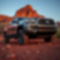 A sleek Toyota Tacoma parked on a rugged terrain