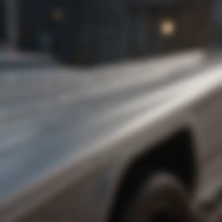 Application of silver bed liner paint on a truck bed