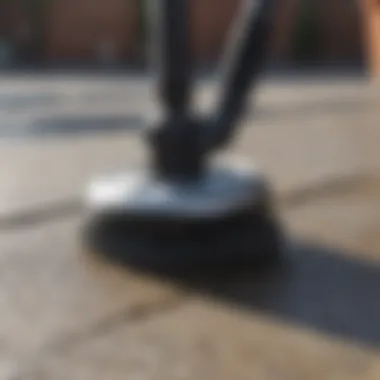 A rotating brush attachment showcasing a powerful cleaning method on a patio