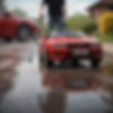 A versatile surface cleaner attachment for pressure washers in action on a driveway