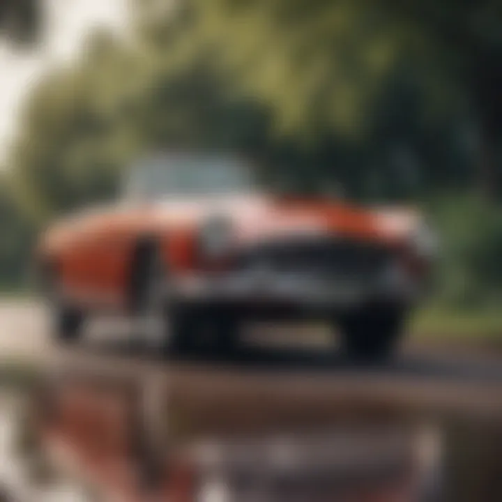 A beautifully restored classic car in a scenic setting.