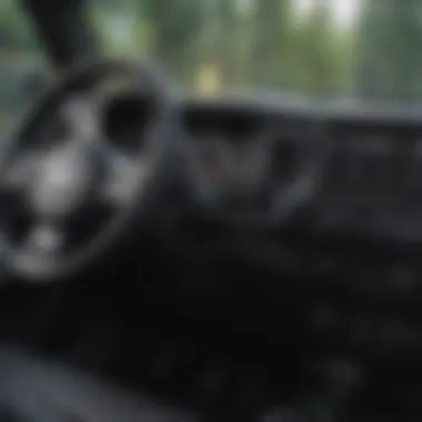 A close-up view of the dashboard and interior of a used Jeep Wrangler.