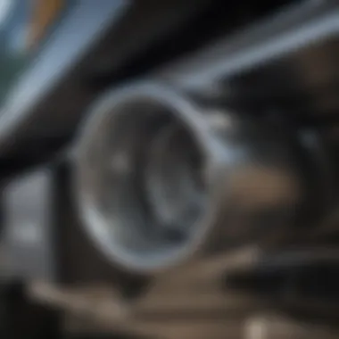 Close-up of a polished stainless steel exhaust tip installed on a truck