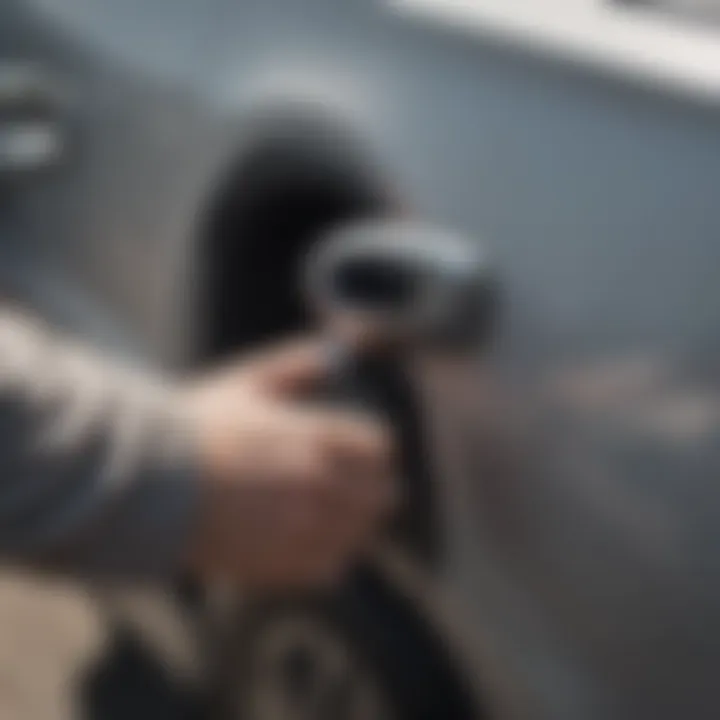 Person performing maintenance on a Hyundai Santa Fe door handle.