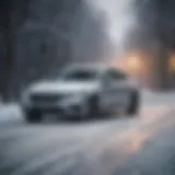 A sleek sedan navigating through a snow-covered road