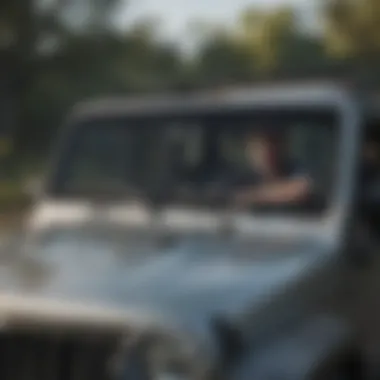 Safety precautions while removing Jeep hard top, showing protective gear and stable setup