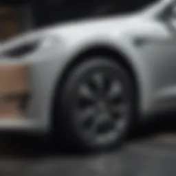 Close-up view of a scratch on a Tesla vehicle's surface showing various depths.