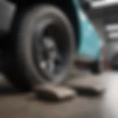 A mechanic inspecting brake pads during a vehicle maintenance check.
