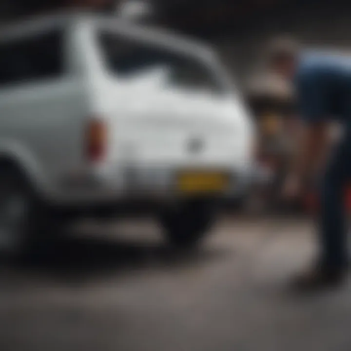 A skilled technician performing hitch installation on a vehicle