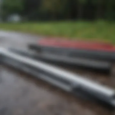 Comparison of Rain X Beam and Traditional Wiper Blades Comparison of Rain X beam wiper blades next to traditional wiper blades, highlighting the differences.