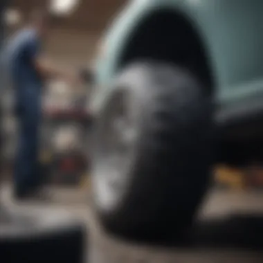 Mechanic balancing a tire on a machine