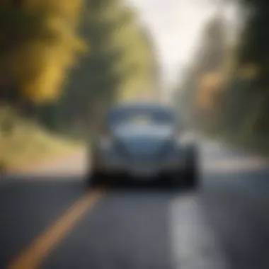 VW Beetle on a scenic road showcasing its manual transmission